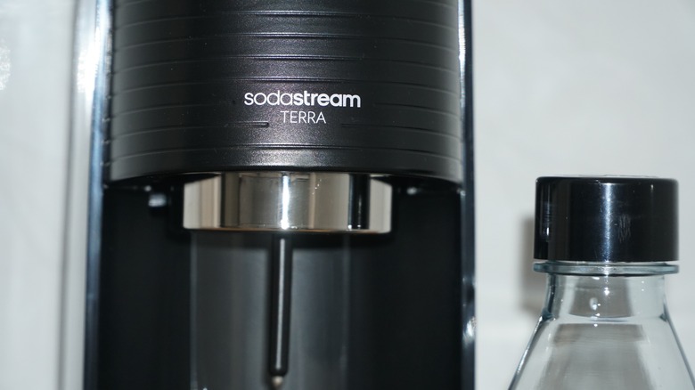 Sodastream closeup and glass bottle