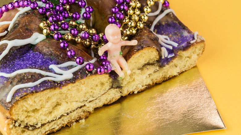 Baby sitting on the King Cake