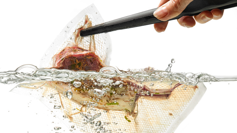 sous-vide steak going into water