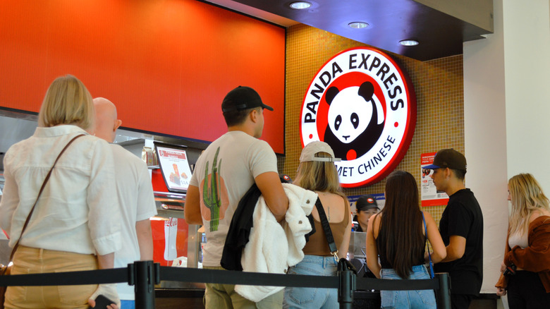 Customers waiting in line at Panda Express counter