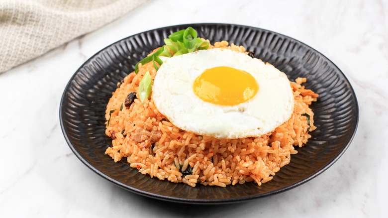 kimchi fried rice topped with an egg 