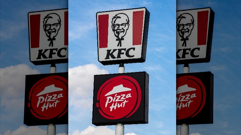 A KFC and Pizza Hut sign next to each other