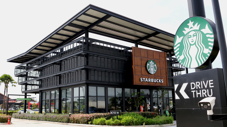 Dark metal building with Starbucks Drive Thru sign