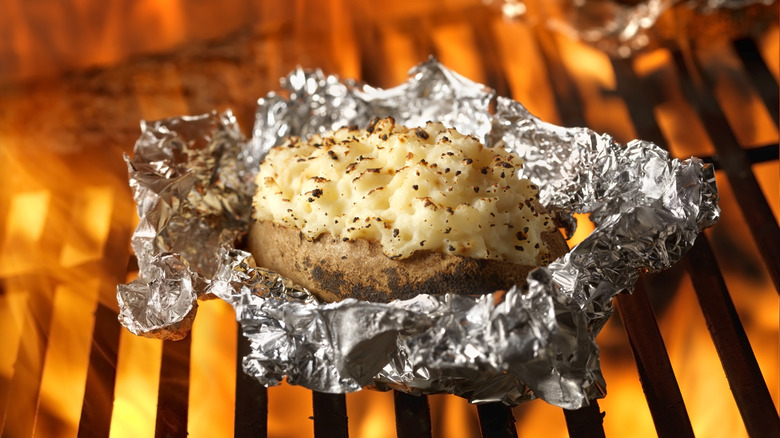 Potato cooking on grill