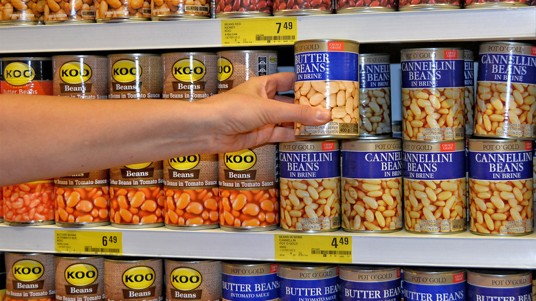 Cans of cannellini beans on a shelf