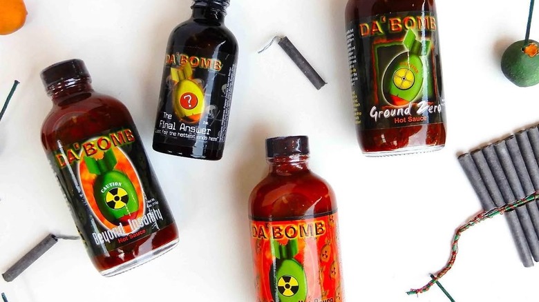 Da' Bomb hot sauces with fireworks