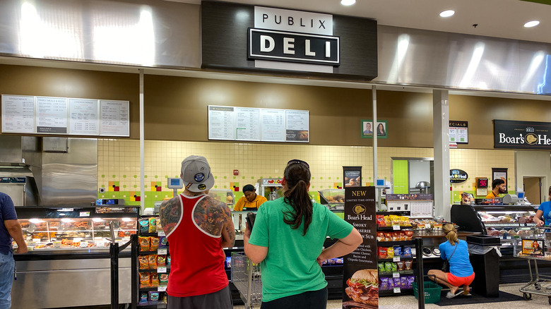 People in line waiting at a Publix deli