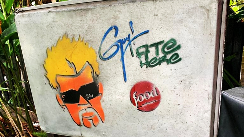 Guy Fieri's stencil on sign