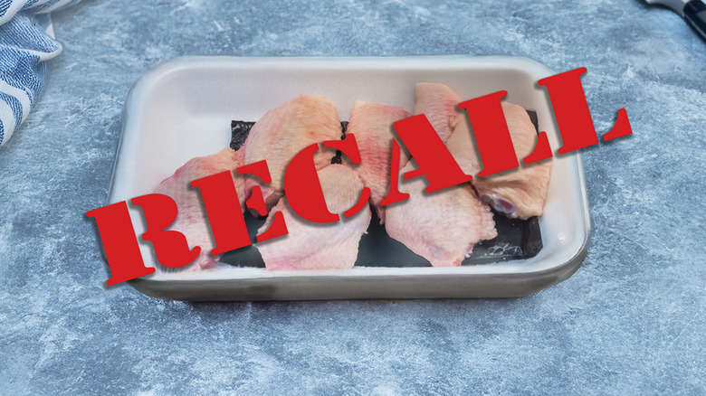 Recall stamp over tray of raw chicken