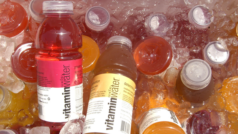 Bottles of Vitamin Water in a cooler with ice