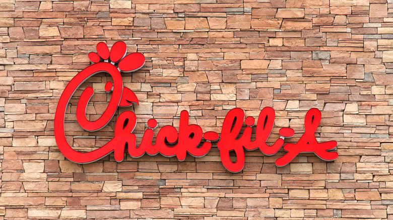 Chick-fil-A sign on brick wall