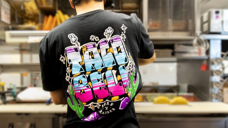 Worker wearing new Taco Bell shirt