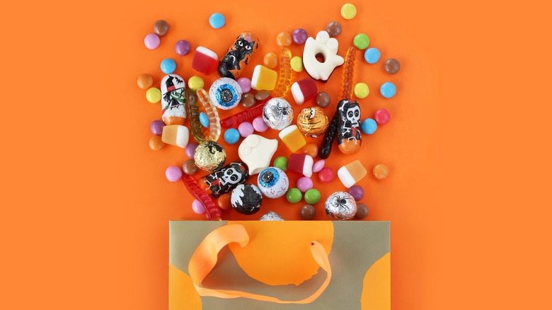 Orange Halloween bag spilling candy