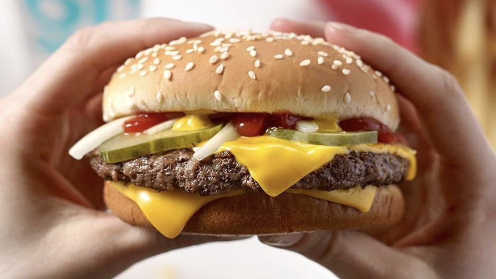 McDonald's burger in person's hands