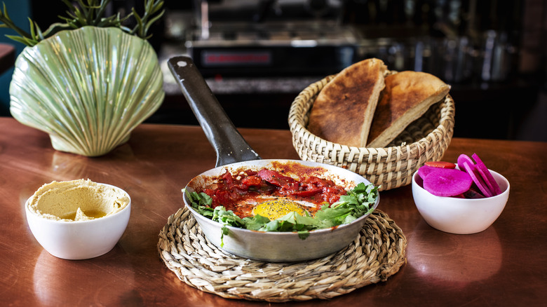 Shakshuka with naan bread at cafe