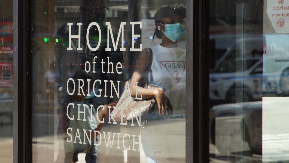 Sign on window at Chick-fil-A: "Home of the original chicken sandwich"