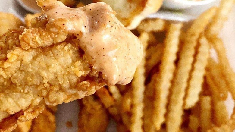 Cane's Sauce on chicken tender