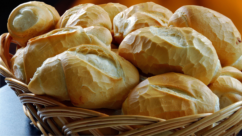 Wicker basket full of bread rolls