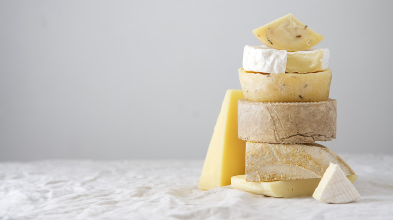 A stack of cheese on a counter. 