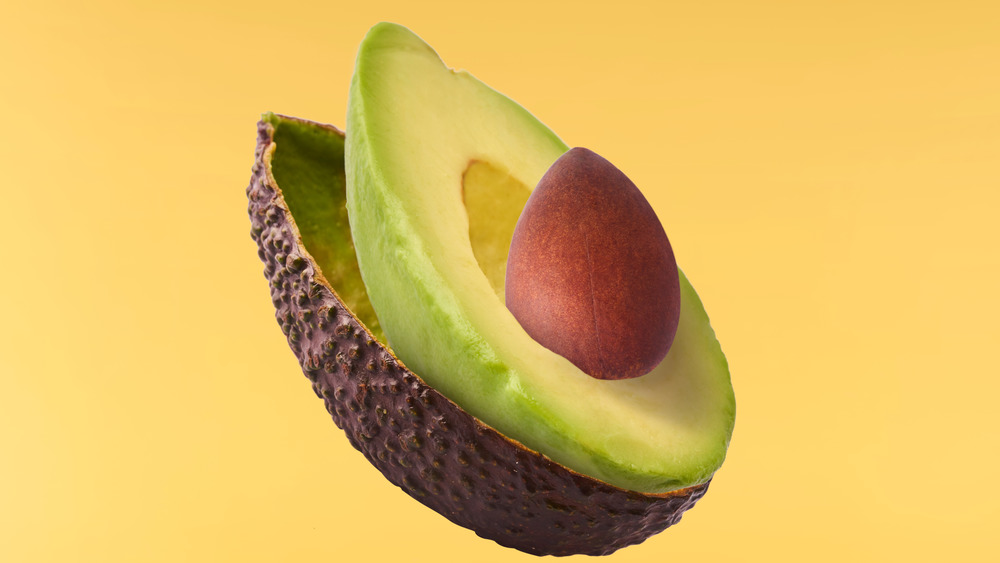 Avocado on yellow background