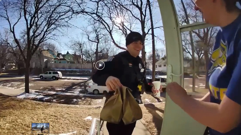 Officer Sam Buhr delivering Doordash order