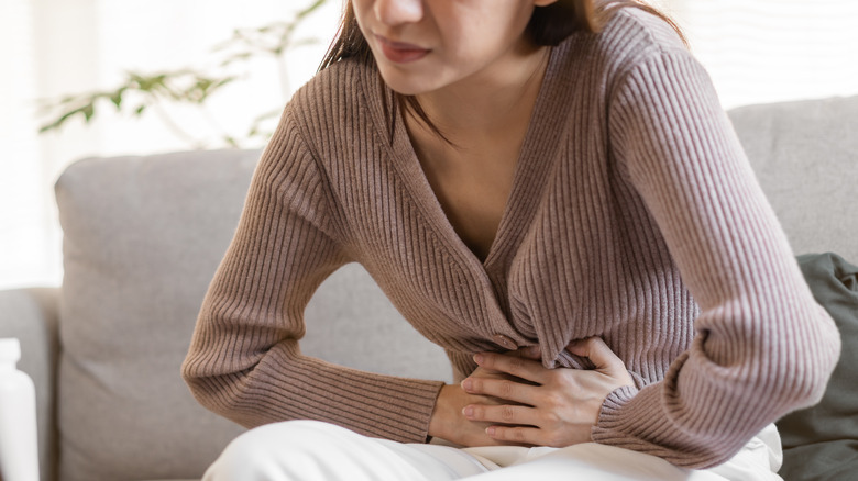 Woman holding her stomach