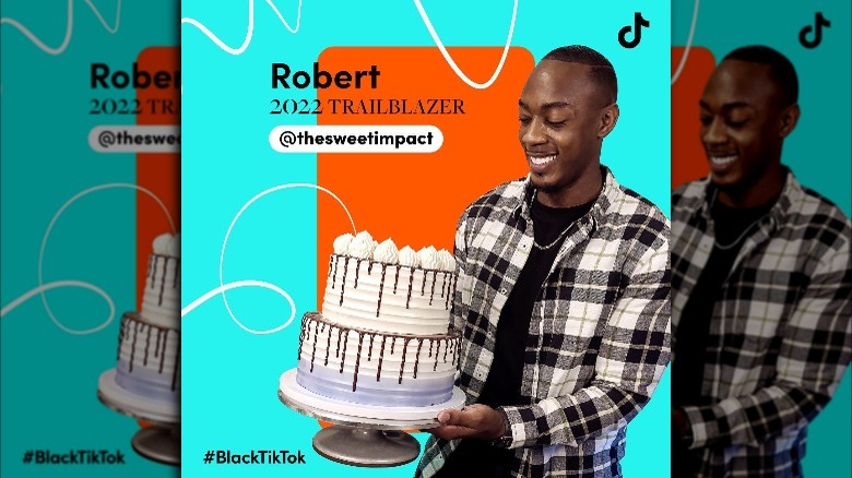 Robert Lucas holding cake as part of TikTok Trailblazer promo