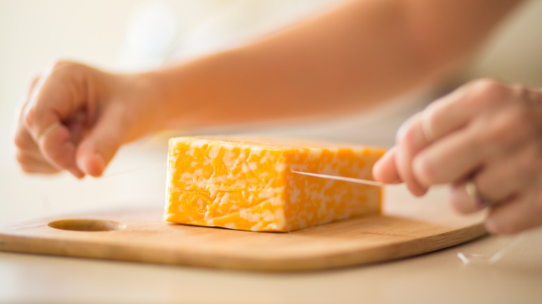 Cutting cheese with floss