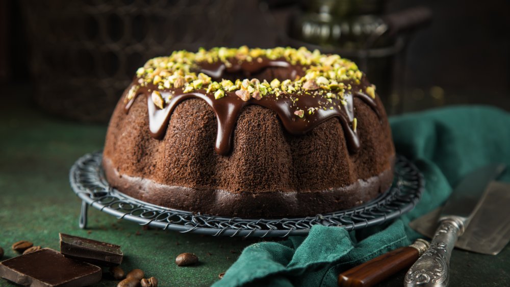 chocolate bundt cake with chocolate ganache and pistachios