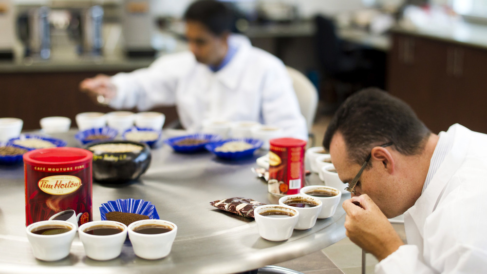 Employees test Tim Hortons coffee for quality control at processing plant