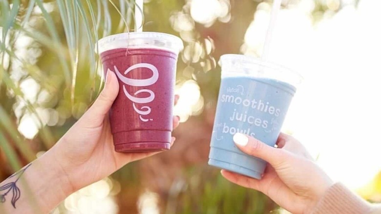 women holding Jamba smoothies