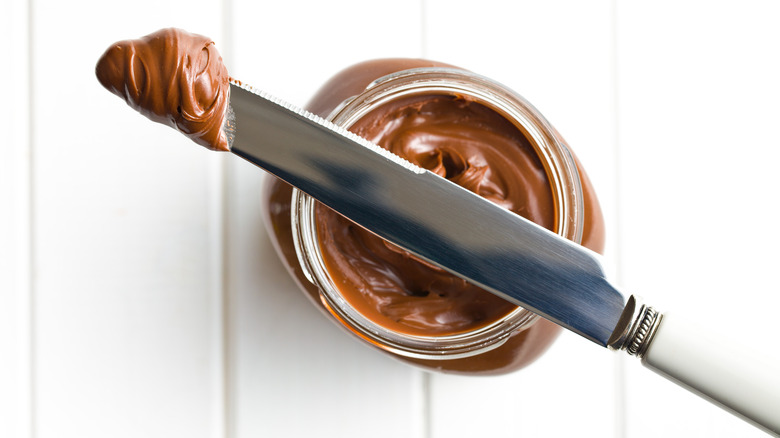 Chocolate-hazelnut spread with butter knife