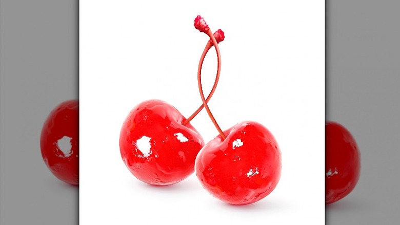 Two maraschino cherries with knotted stems 