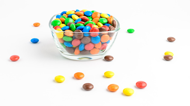 A glass bowl of M&M candies