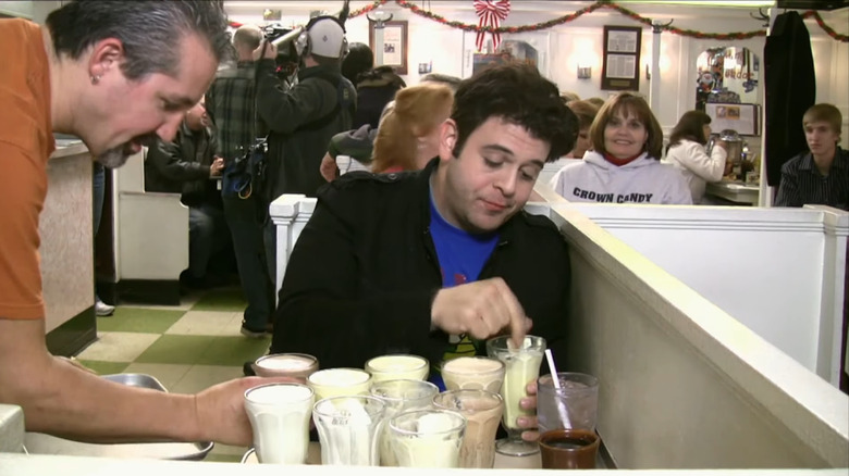 Adam drinking a malted milkshake