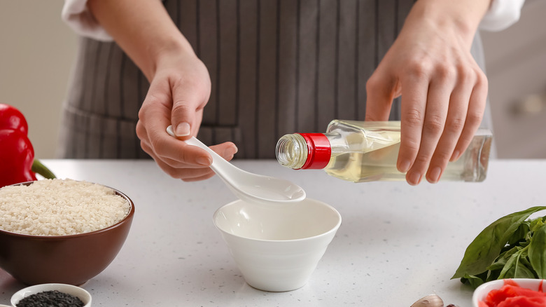 woman cooking with rice vinegar