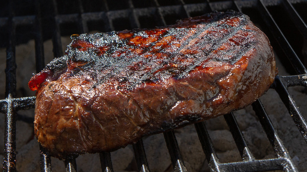 a steak on a grill