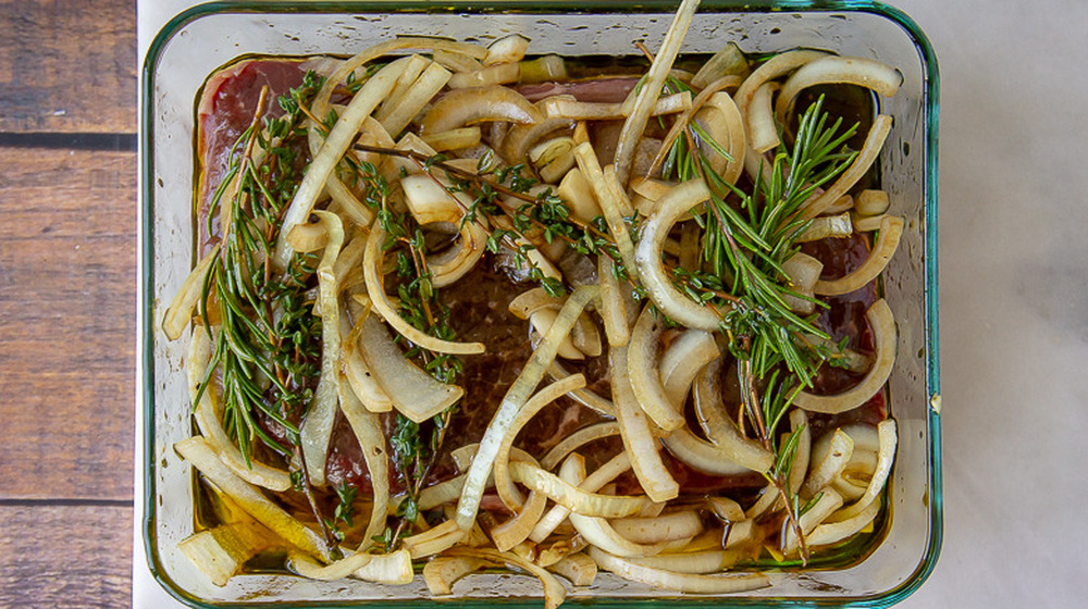 raw steak with onions