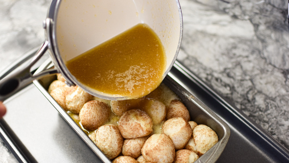 pouring sauce on monkey bread