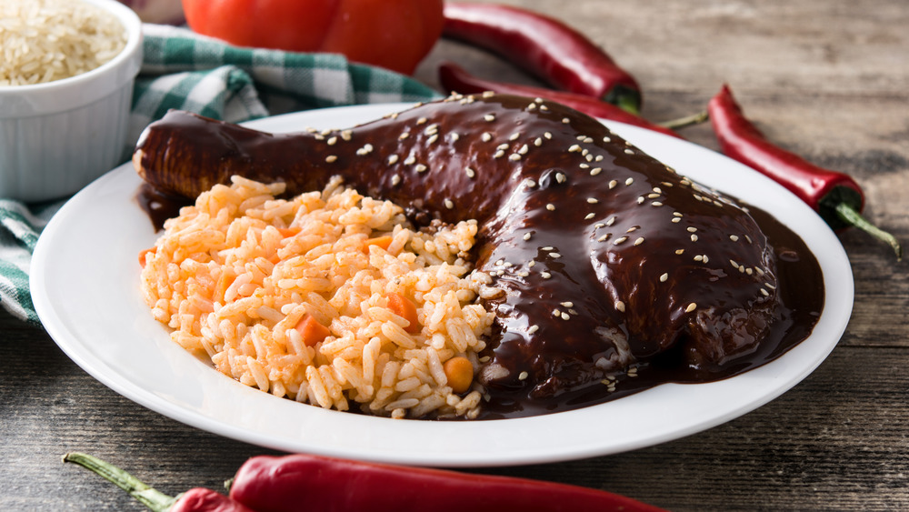 Mole chicken with rice and ingredients