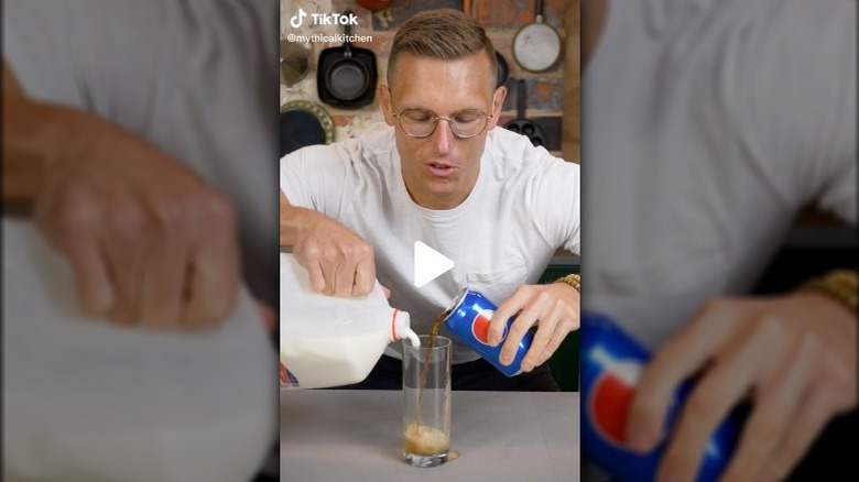 Guy mixing milk and Pepsi