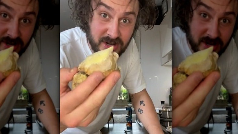 Man holding ginger root