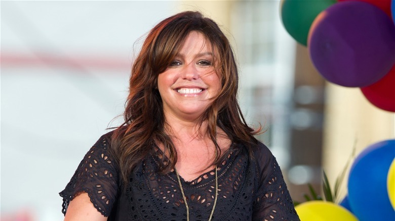 Rachael Ray smiling with hair blowing