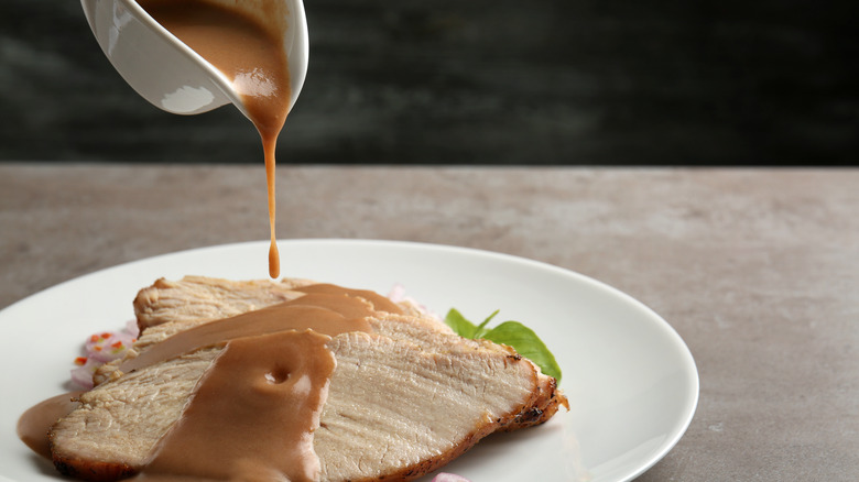 Plate of turkey with gravy poured on top