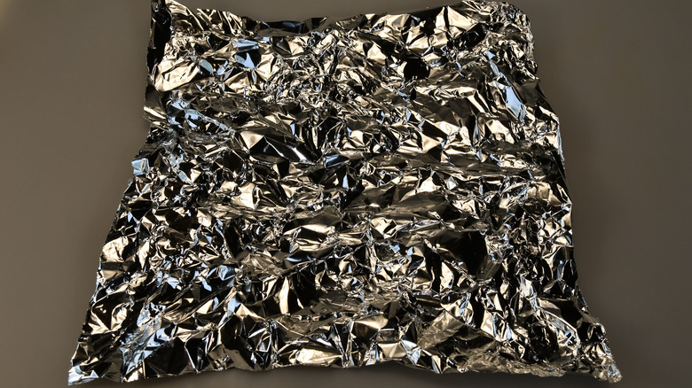 A sheet of crumpled tinfoil