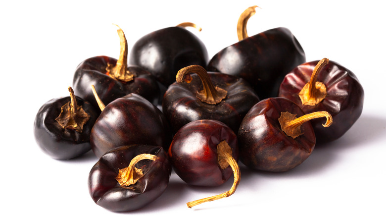 Cascabel chilis on white background