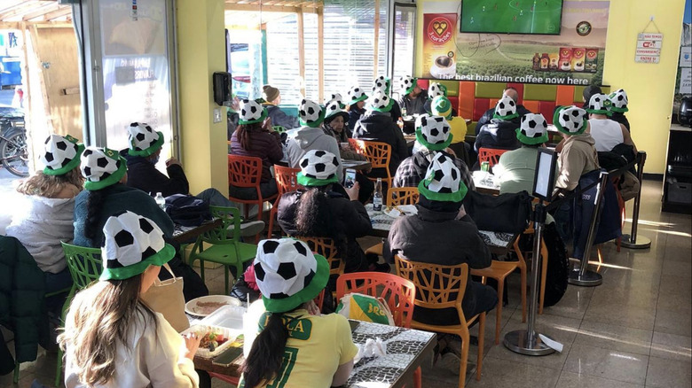 Soccer enthusiasts at Rio Market Queens