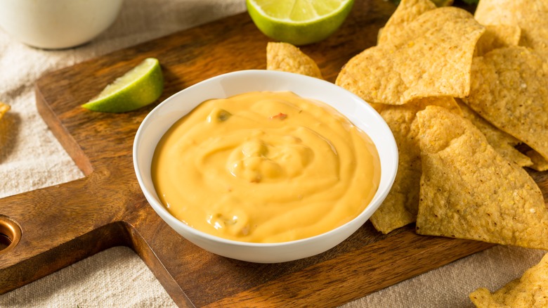 yellow nacho cheese dip in a dish