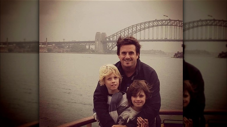 Darren Simpson poses with his sons