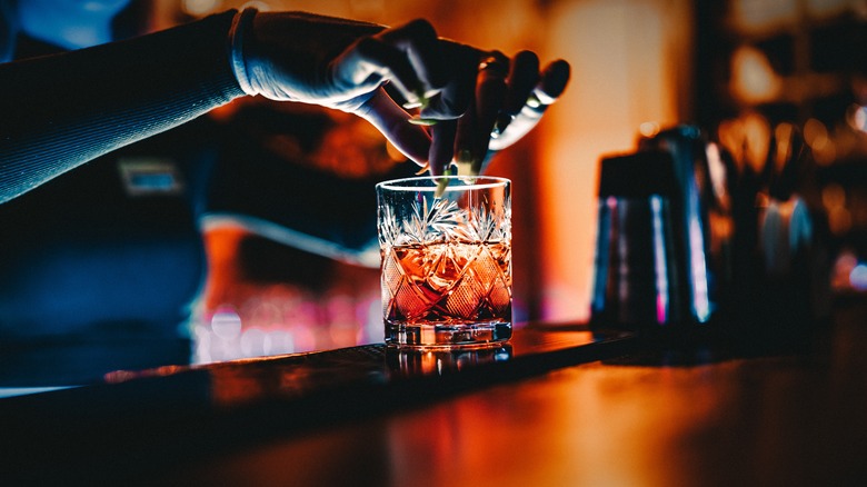 Woman mixing cocktail